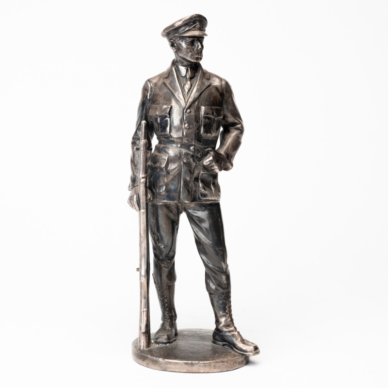 Old silver-plated metal officer statue